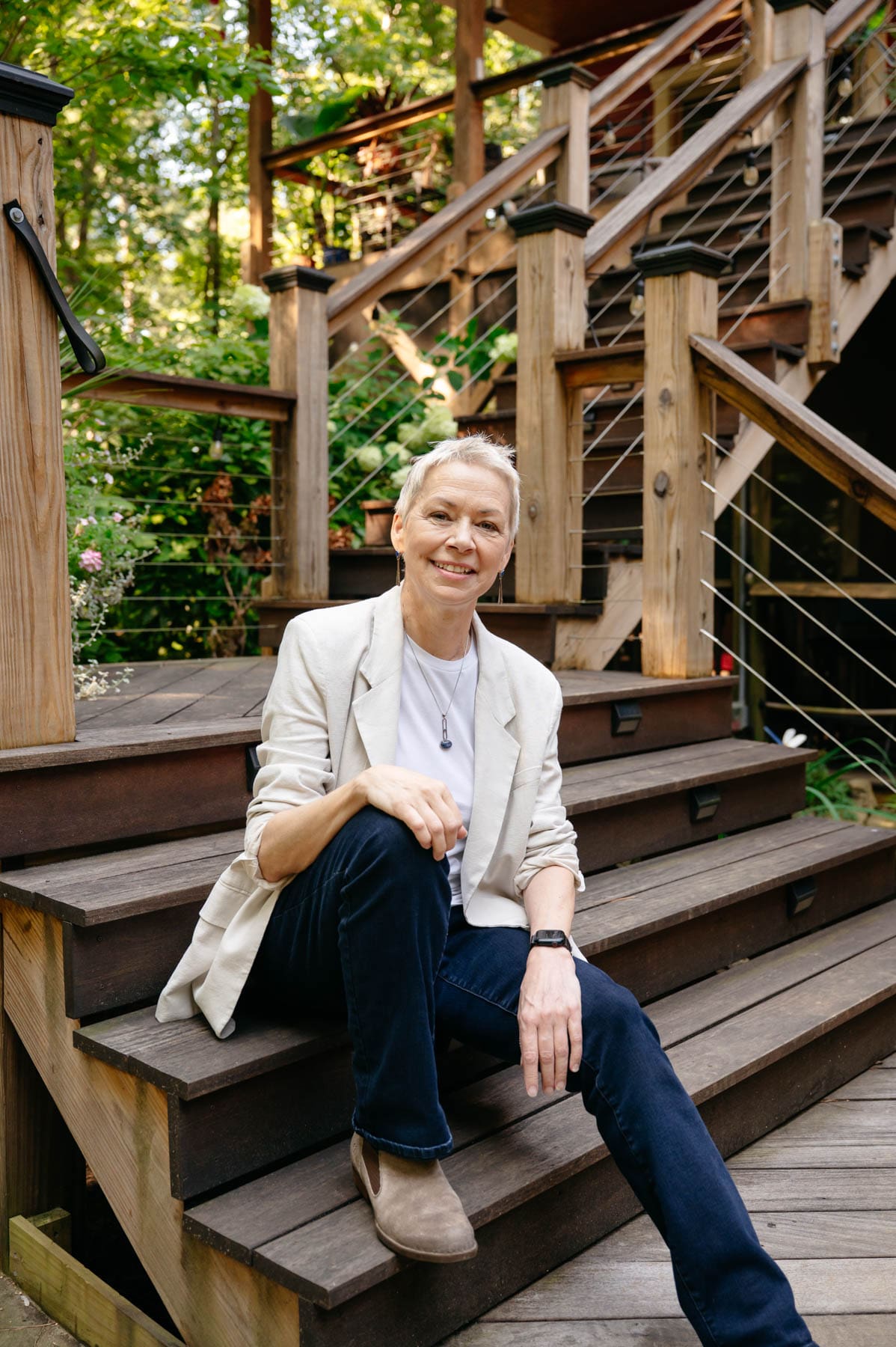 Portrait of Chatham County Commissioner Amanda Robertson, smiling confidently in front of a blurred outdoor background.