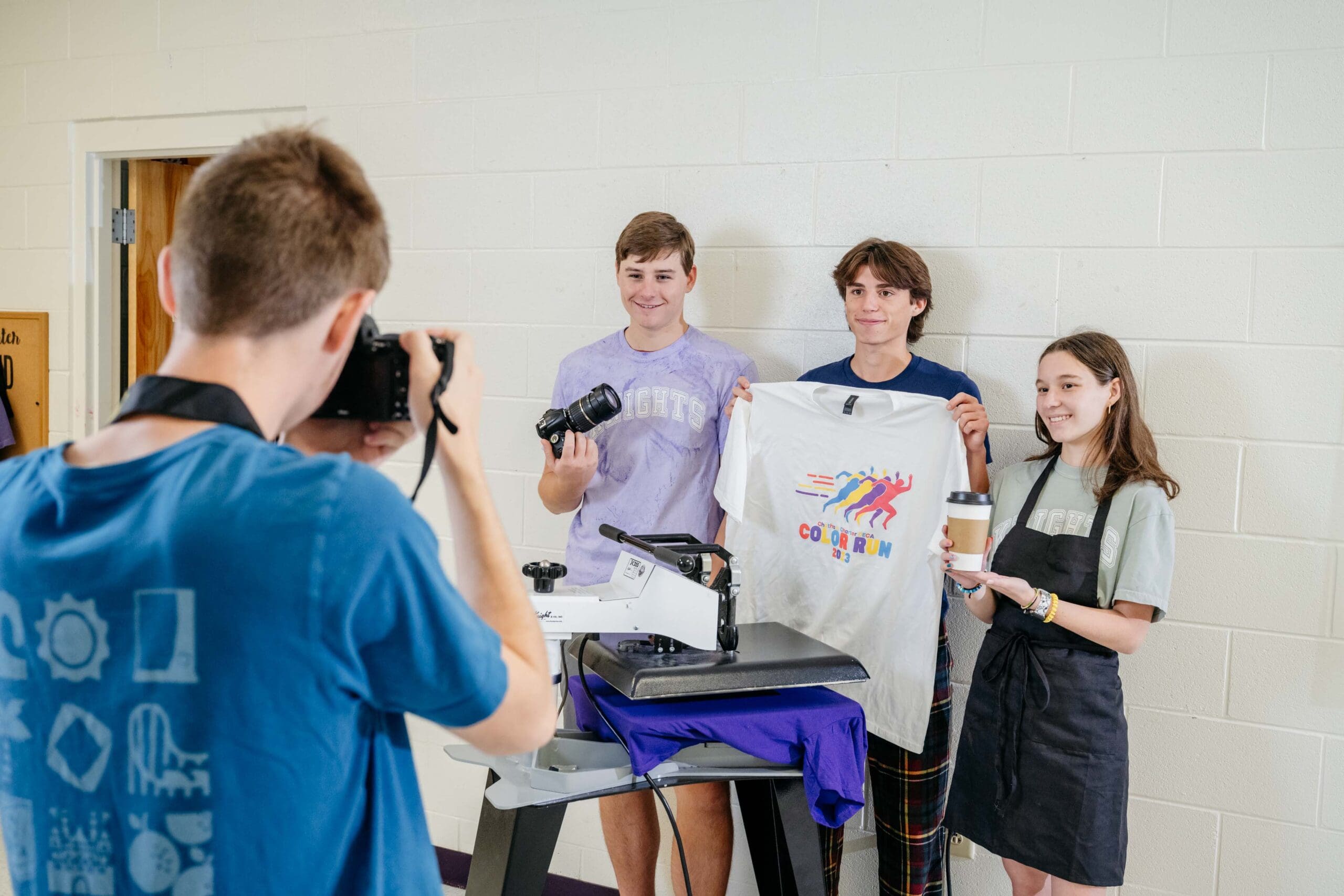 Chatham Charter DECA's Adam Reese capturing student business leaders on camera.