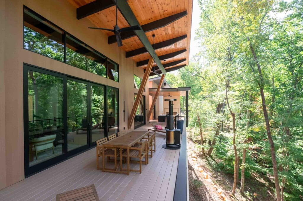 The home's porch offers sunlight and views of nature. 