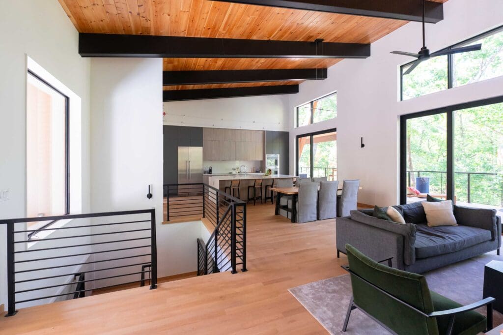 The living room of the custom home has plenty of natural light and seating areas. 