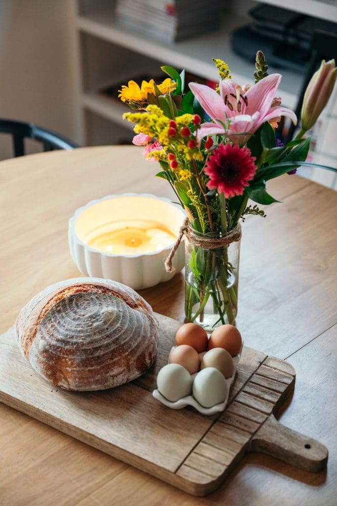 Flowers and homemade bread waits for guests at the Loblolly House Airbnb in Chatham County.  