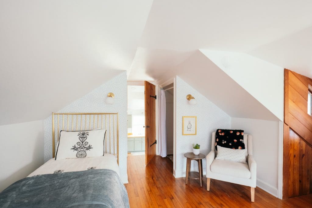A twin bed and comfortable chair in the Chatham County home offer the perfect space for visiting families with kids. 