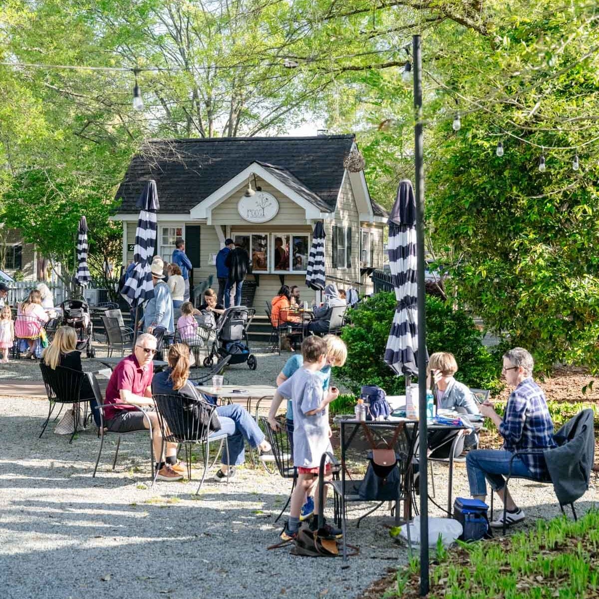People gather at outside tables at Roost Beer Garden at Fearrington Village to socialize and relax in the sun