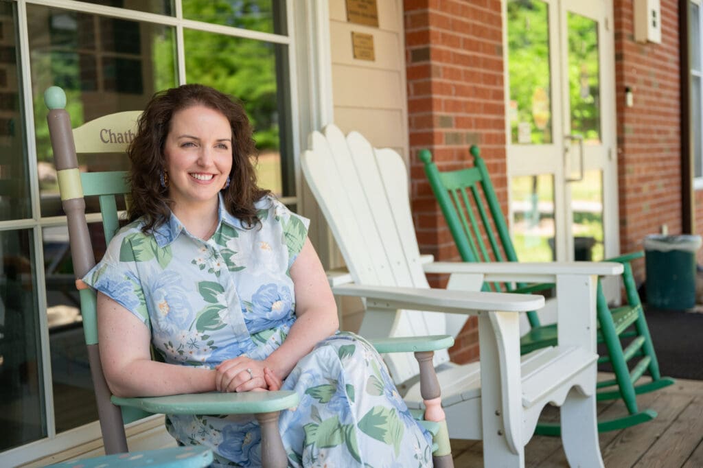 Ashlyn Martin sitting in a rocking chair.