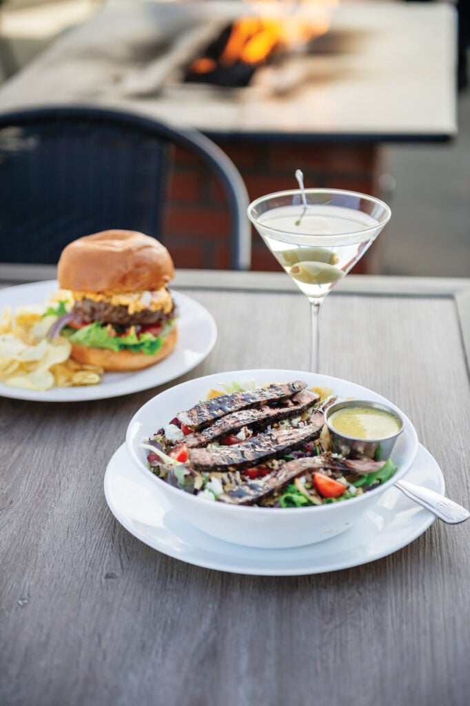 A dirty martini alongside the steak and bleu salad and a cheeseburger from Best of Chatham winner The Mod.
